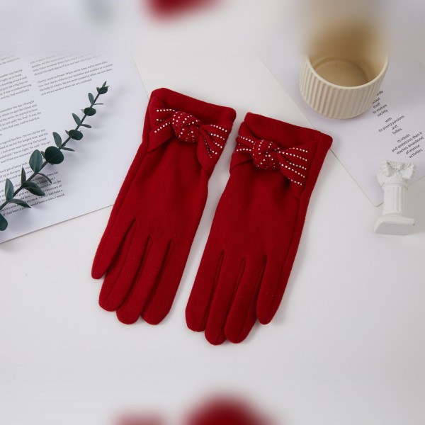Bow Accent Gloves with a soft brushed finish and a sweet decorative bow at each wrist for a feminine, polished look. The fitted five finger silhouette keeps hands warm and pairs beautifully with wool coats and dressy winter outfits. Lovely for holiday parties, church, date nights, and everyday errands. Pretty bow gloves make a thoughtful gift and are an easy add on sale in any cold weather accessory display.