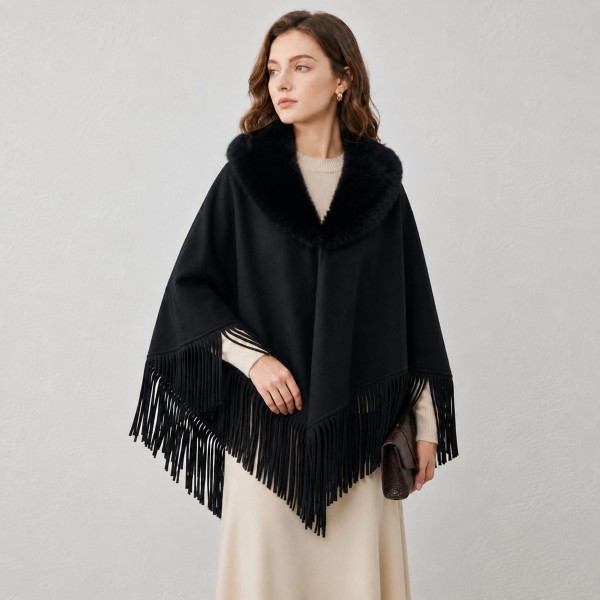 Faux Fur Collar Fringe Poncho in a soft, brushed fabric with a plush fur trimmed neckline and swingy fringe along the hem. The relaxed, open drape layers easily over sweaters, tees, and dresses for effortless warmth. Cozy enough for chilly mornings and polished enough for holiday gatherings and weekend outings. Ponchos are a dependable fall and winter seller, and the fur collar gives this style a fresh, giftable upgrade.
