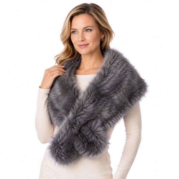 Faux Fur Stole Wrap with a long, shaggy pile and a generous length that crosses at the front or drapes open over the shoulders. It adds instant glamour to evening dresses, sweaters, and winter coats. A favorite for holiday parties, weddings, date nights, and cold weather events. Faux fur wraps are a seasonal must have and an easy gift, and they sell through fast from fall into the new year.