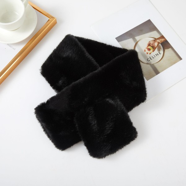 Faux Fur Pull Through Scarf with a soft, velvety pile and a keyhole loop that holds it neatly in place without knots. The cropped length sits close to the neck for warmth without bulk under coats and jackets. Plush, cozy, and easy to style for commutes, school pickup, and cold weather outings. Keyhole fur scarves are a winter bestseller and a natural gift from fall straight through the holidays.