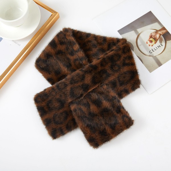 Faux Fur Pull Through Scarf with a soft, velvety pile and a keyhole loop that holds it neatly in place without knots. The cropped length sits close to the neck for warmth without bulk under coats and jackets. Plush, cozy, and easy to style for commutes, school pickup, and cold weather outings. Keyhole fur scarves are a winter bestseller and a natural gift from fall straight through the holidays.