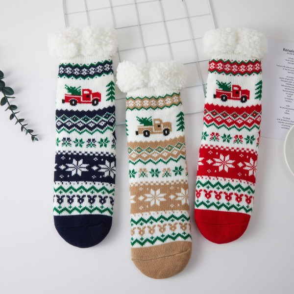 Holiday Truck Fair Isle Sherpa Slipper Socks featuring a classic knit pattern of snowflakes and trees topped with a vintage truck hauling a Christmas tree. A plush sherpa lining and fluffy fold over cuff keep feet toasty on cold mornings, movie nights, and Christmas Eve by the fire. Packed as an assortment of coordinating designs. Cozy holiday socks are a top stocking stuffer and gift exchange pick, and this nostalgic truck motif sells fast from November through the holidays.