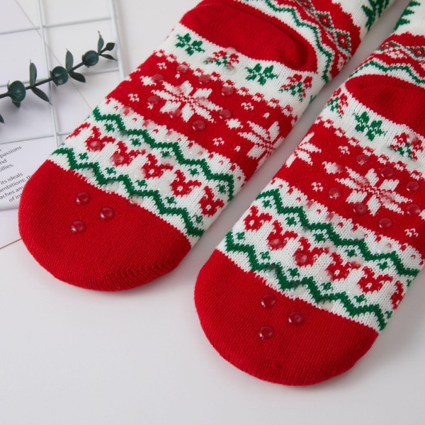 Holiday Truck Fair Isle Sherpa Slipper Socks featuring a classic knit pattern of snowflakes and trees topped with a vintage truck hauling a Christmas tree. A plush sherpa lining and fluffy fold over cuff keep feet toasty on cold mornings, movie nights, and Christmas Eve by the fire. Packed as an assortment of coordinating designs. Cozy holiday socks are a top stocking stuffer and gift exchange pick, and this nostalgic truck motif sells fast from November through the holidays.