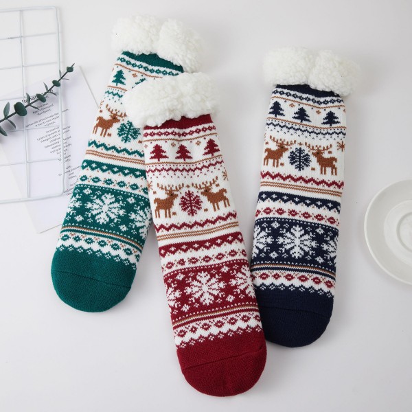 Fair Isle Reindeer Sherpa Slipper Socks knit with prancing reindeer, snowflakes, and evergreen trees in a timeless holiday pattern. A cushy sherpa lining and fold over cuff wrap feet in warmth for cozy mornings, cabin weekends, and Christmas morning photos. Packed as an assortment of coordinating designs. Classic fair isle socks are a reliable holiday bestseller and a favorite gift for teachers, coworkers, and family.