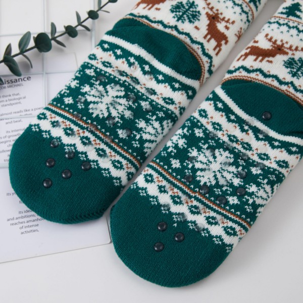 Fair Isle Reindeer Sherpa Slipper Socks knit with prancing reindeer, snowflakes, and evergreen trees in a timeless holiday pattern. A cushy sherpa lining and fold over cuff wrap feet in warmth for cozy mornings, cabin weekends, and Christmas morning photos. Packed as an assortment of coordinating designs. Classic fair isle socks are a reliable holiday bestseller and a favorite gift for teachers, coworkers, and family.