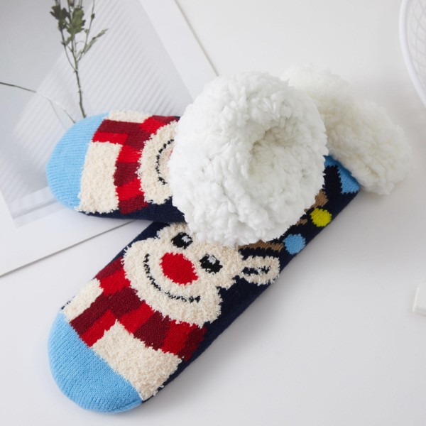 Reindeer Sherpa Slipper Socks with a cozy knit design featuring a smiling reindeer face, a cheerful knit scarf, and playful polka dots. A plush sherpa lining and fluffy fold over cuff keep feet toasty on cold mornings, movie nights, and holiday travel. Packed as an assortment of designs. Festive slipper socks are a top stocking stuffer and an easy register add on, and they sell through quickly all season long.