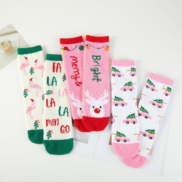 Merry and Bright Fuzzy Holiday Crew Socks in assorted festive designs, including a Fa La La La Mingo flamingo print, a vintage car carrying a Christmas tree, and a cheerful reindeer with Merry and Bright lettering. The soft, plush knit feels cozy on cold floors and fits easily into boots and sneakers. Packed as an assortment of coordinating designs. Fun holiday socks are the ultimate stocking stuffer, and this lighthearted collection is priced to move in multiples.
