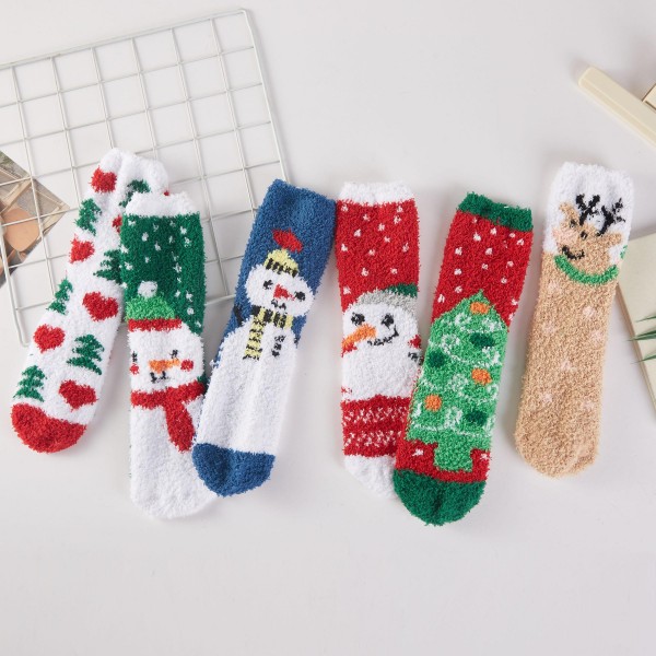 Christmas Fuzzy Socks featuring festive knit designs like snowmen, Christmas trees, reindeer, and hearts on a plush, cozy knit. Soft and warm for lounging by the fire, holiday movie marathons, and Christmas morning photos in matching pajamas. Sold in an assorted pack so every customer finds a favorite. The ultimate stocking stuffer and gift exchange pick, holiday fuzzy socks are a low price, high volume seller from November through New Year.
