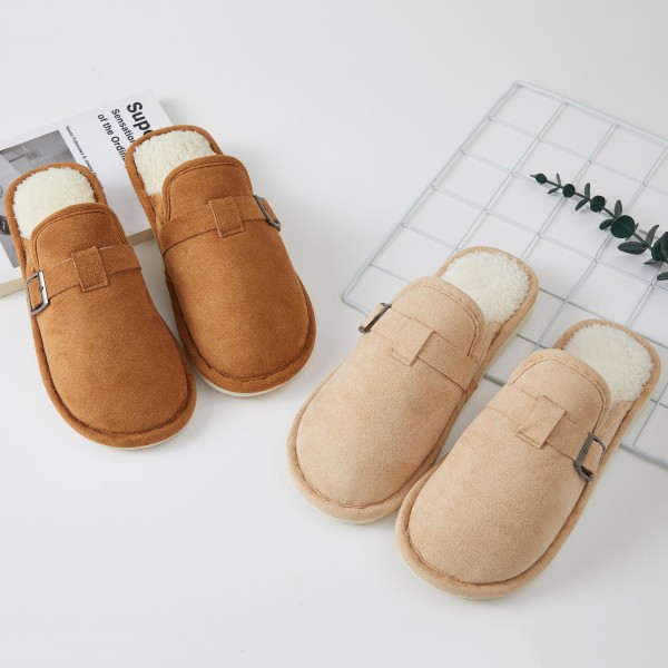 Faux Suede Buckle Clog Slippers with a plush sherpa lining, a side buckle strap detail, and a sturdy cushioned sole. The clean, minimal clog shape looks put together enough for a quick coffee run yet feels cozy enough to wear around the house all day. Easy to slip on and off for busy mornings and relaxed weekends. Clog slippers are one of the season's most requested cozy styles, and this versatile design is an easy gift for anyone on the list.