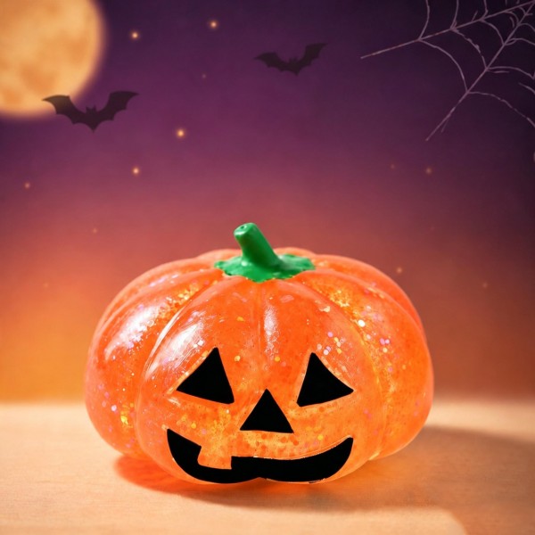 Glitter-filled pumpkin squishy with a carved jack-o-lantern face, a molded stem, and a soft gel body that flattens and reshapes on every squeeze. Suspended sparkle catches the light, giving a plain bowl display real shelf presence. An easy October impulse buy for counters, classroom treats, and trick-or-treat alternatives to candy. Sized to stack in a basket and priced to move in multiples.
