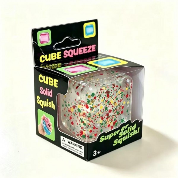 Confetti cube squishy filled with tiny holiday flecks suspended in a clear jelly block that catches the light from every angle. The soft body flattens under a squeeze and drifts back into a cube shape. A quiet fidget that looks like decor when it is sitting out on a desk or a shelf. Seasonal sparkle at an impulse price point.