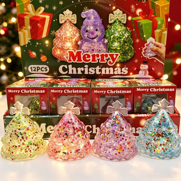 Twelve-piece Christmas tree squishy display in a printed holiday counter box. Each glitter-filled tree is individually boxed, with suspended sparkle that shifts as the soft body squishes and springs back. Assorted colors give the display real shelf presence in a small counter footprint. A reliable stocking-stuffer and teacher-gift program that moves by the dozen.