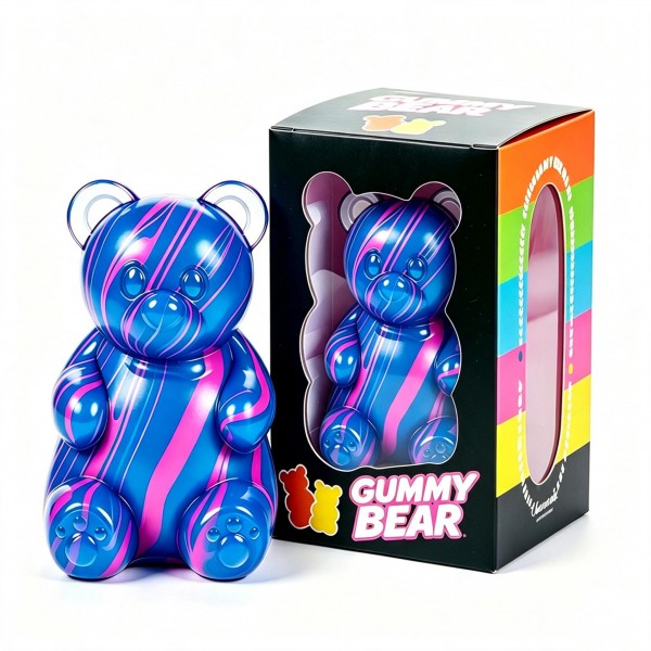 Oversized gummy bear squishy in a translucent swirl finish, packed in a printed window box. The slow-rise body squeezes flat and springs back, and the window packaging invites a try-me squeeze on the shelf while doubling as gift packaging. Candy-inspired squishies cross over to teens and adults, which widens the buyer well past the toy aisle. A giftable price point that supports full margin on a small shelf footprint.