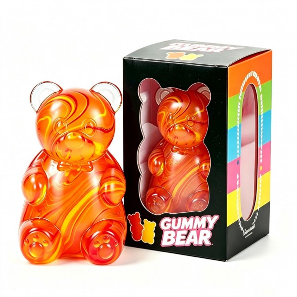 Oversized gummy bear squishy in a translucent swirl finish, packed in a printed window box. The slow-rise body squeezes flat and springs back, and the window packaging invites a try-me squeeze on the shelf while doubling as gift packaging. Candy-inspired squishies cross over to teens and adults, which widens the buyer well past the toy aisle. A giftable price point that supports full margin on a small shelf footprint.