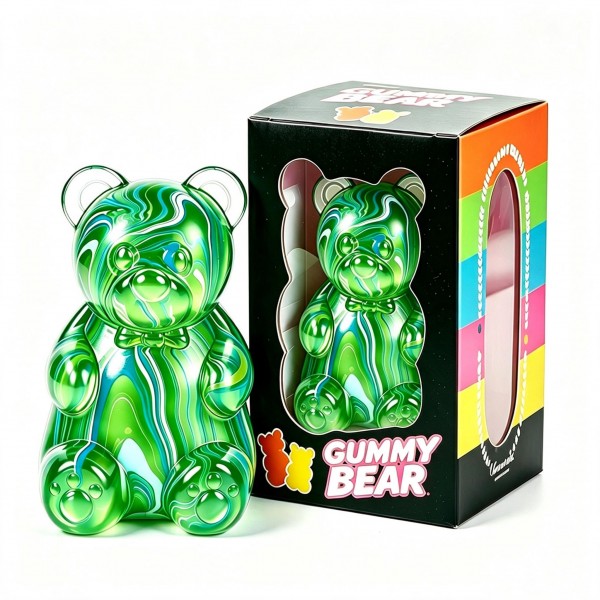 Oversized gummy bear squishy in a translucent swirl finish, packed in a printed window box. The slow-rise body squeezes flat and springs back, and the window packaging invites a try-me squeeze on the shelf while doubling as gift packaging. Candy-inspired squishies cross over to teens and adults, which widens the buyer well past the toy aisle. A giftable price point that supports full margin on a small shelf footprint.