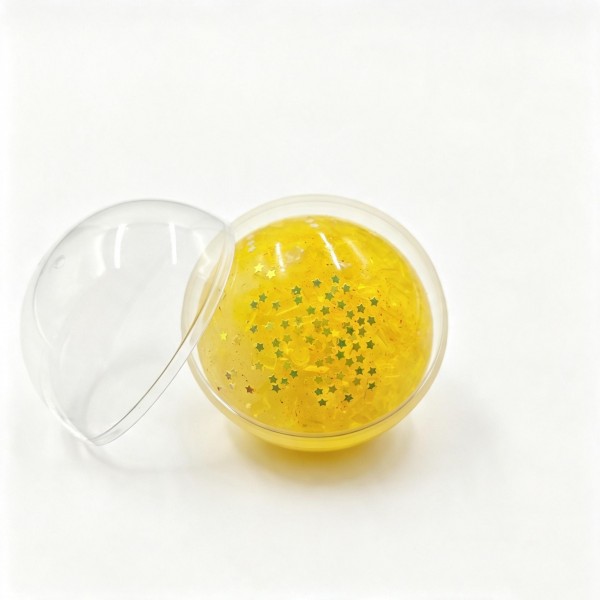 Bead filled squeeze ball packed inside a clear fillable ornament, so it works as a gift, an ornament, and a fidget all at once. The stretchy skin holds a soft bead core that shifts and crunches under your fingers. A satisfying stress reliever for desks, backpacks, and travel bags. Ornament packaging makes it a natural for holiday trees, gift toppers, and seasonal displays.