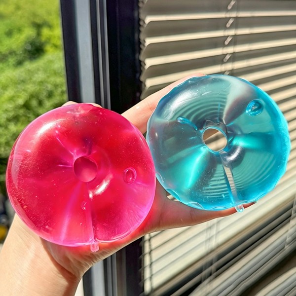 Donut squeeze ball packed in a printed window box, molded with a glossy glazed top and a soft gel body that flattens and slowly rebounds. The bakery styling makes it a natural on a food themed display or a checkout counter. A fun stress reliever for desks, backpacks, and car rides. Boxed and ready to hang, stack, or gift as is.