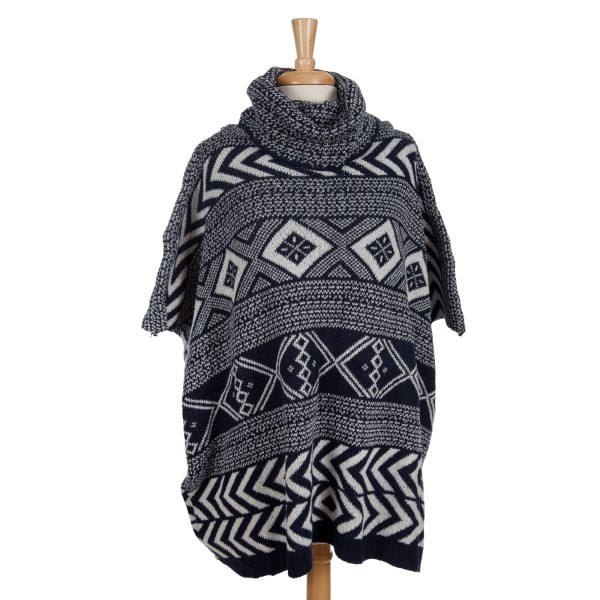 Heavyweight navy blue and white Aztec printed, turtleneck poncho top with short sleeves. 100% acrylic. One size fits most. 