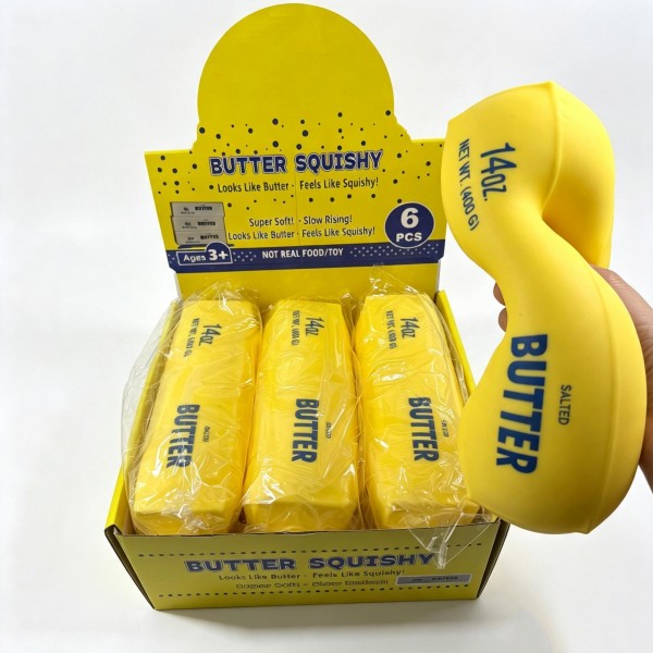 Butter block squishy molded as a flat printed slab with a soft matte finish and a slow rise squeeze. Sized to sit flat on a desk or a kitchen shelf where it reads as decor until someone picks it up. A playful gift for bakers, cooks, and anyone who appreciates a good food novelty. Easy to stack and merchandise in a basket at the counter.
