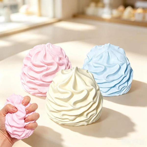 Oversized whipped cream swirl squishy molded as a tall piped dollop with soft ridged detail. Slow rise foam sinks under a squeeze and springs back to shape, giving that satisfying stress relief kids and adults both chase. A counter impulse toy for boutiques stocking birthday favors, classroom rewards, sensory bins, and stocking stuffers. Dessert squishies photograph well on a display riser and reorder as fast as they ring up.