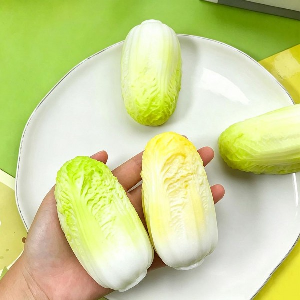 Cabbage squishy sealed in a clear wrap, molded with layered leaf detail and a soft slow rise squeeze that looks startlingly like the real thing. The grocery styling is the whole joke and it lands the moment someone picks it up. A fun kitchen gift, a quiet desk fidget, and an easy conversation starter. Realistic produce squishies photograph well and move on sight.