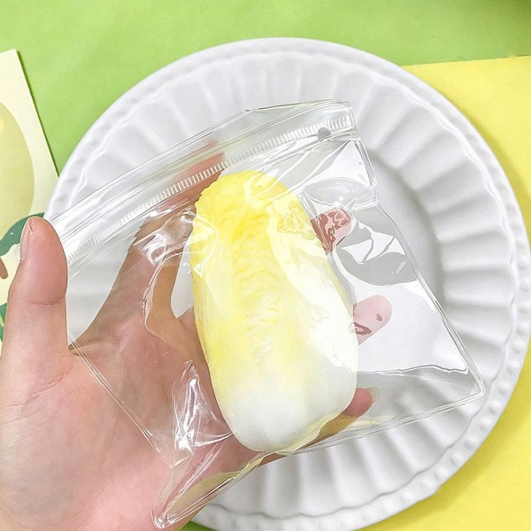 Cabbage squishy sealed in a clear wrap, molded with layered leaf detail and a soft slow rise squeeze that looks startlingly like the real thing. The grocery styling is the whole joke and it lands the moment someone picks it up. A fun kitchen gift, a quiet desk fidget, and an easy conversation starter. Realistic produce squishies photograph well and move on sight.