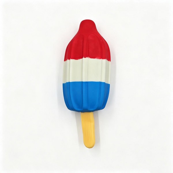 Rocket popsicle squishy molded as a layered ice pop on a stick with a smooth matte finish. Slow rise foam compresses under a squeeze and slowly returns to shape for repeat fidgeting. A counter impulse toy for boutiques stocking birthday favors, summer camp, classroom rewards, and party favors. Novelty food squishies are the piece customers pick up on the way to the register and buy without thinking.
