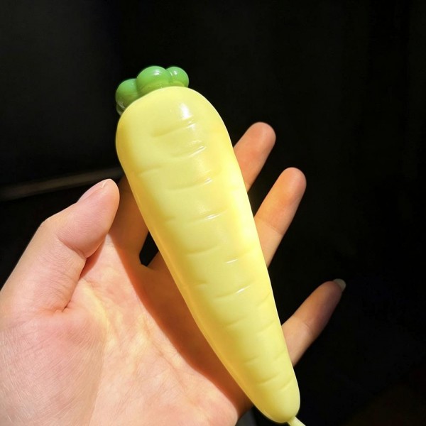 Carrot squishy molded with ridged root detail and a leafy top, stretched long so it fills the hand. The soft body squeezes down the length and rebounds slowly for a satisfying reset. A garden themed desk toy that works for spring displays, Easter baskets, and everyday gifting. Long form squishies like this stand out in a bin and invite a second look.