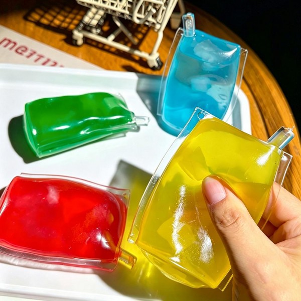 Ice pop squishy sealed in a clear sleeve, molded with a frosted jelly look and suspended cube detail that shifts as you squeeze. The soft gel body flattens under pressure and rebounds slowly for a satisfying reset. A cooling, summery novelty for freezer pop displays, pool shop merchandising, and party favors. Bright packaging makes it an easy grab for kids and gift buyers.