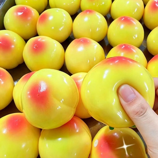 Peach squishy with a soft blush finish, a rounded cleft, and a slow rise squeeze that eases back into shape. Sized to sit comfortably in the palm for fidgeting during calls, homework, or a long drive. A sweet, giftable stress reliever for teens, teachers, and anyone who keeps a desk toy handy. Fruit squishies are consistent impulse performers at the register.