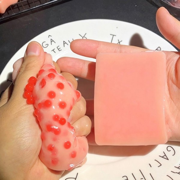 Soap bar squishy molded and painted to look like a fresh cut bar of soap, with a soft slow rise squeeze and a smooth glossy surface. The realistic food and bath styling makes it a double take novelty on a counter display. A fun desk toy for teens and adults and an easy add on at the register. Small footprint, quick turns, and a price point that invites a second one.