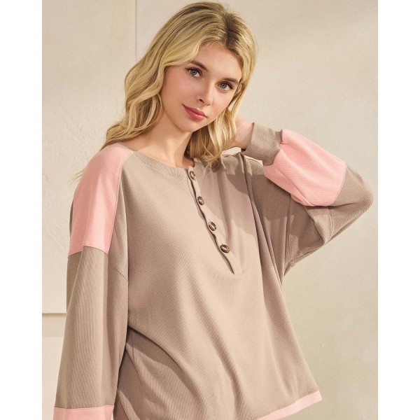 Color block waffle knit henley top with a buttoned placket and a relaxed drop-shoulder silhouette. Soft ribbed-texture knit gives the oversized cut structure, while contrast panels at the shoulders and cuffs add visual interest to an everyday staple. Easy to layer over leggings, denim, or bike shorts for weekend errands, school pickup, and cozy fall weather. A transitional long sleeve top that turns fast for boutiques building comfortable seasonal assortments.