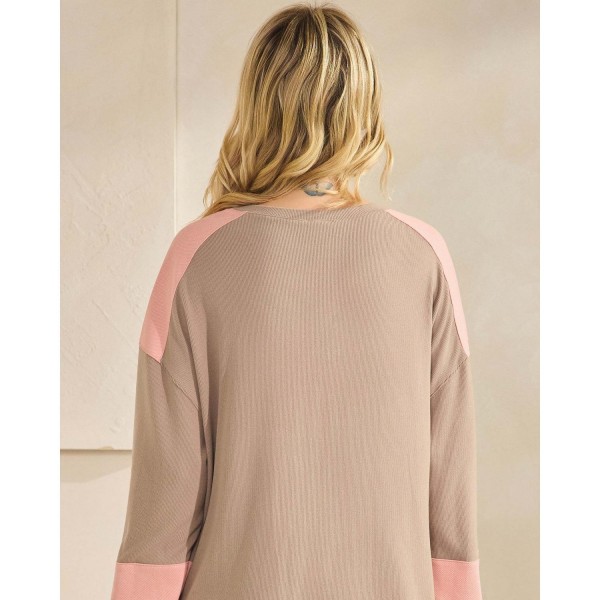Color block waffle knit henley top with a buttoned placket and a relaxed drop-shoulder silhouette. Soft ribbed-texture knit gives the oversized cut structure, while contrast panels at the shoulders and cuffs add visual interest to an everyday staple. Easy to layer over leggings, denim, or bike shorts for weekend errands, school pickup, and cozy fall weather. A transitional long sleeve top that turns fast for boutiques building comfortable seasonal assortments.