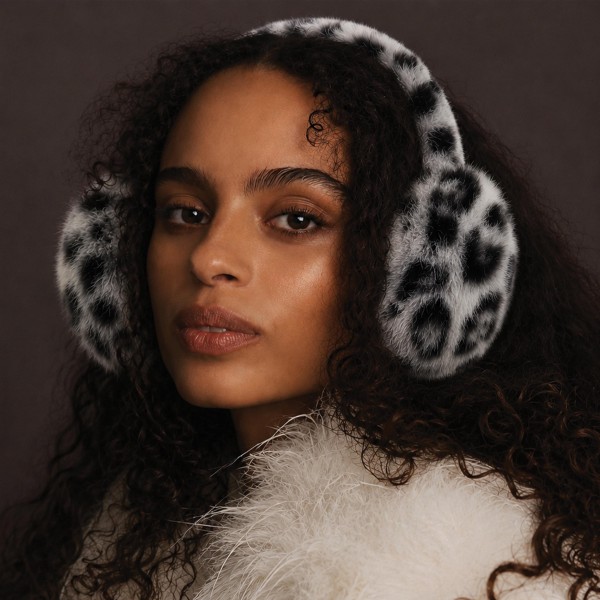 Plush faux fur earmuffs with a padded band and an allover animal print. The soft pile traps warmth without flattening a hairstyle, and the band folds down for easy storage in a coat pocket. Print earmuffs read fun and photograph well, which makes them a strong front of store pick. A quick add on sale once temperatures drop.