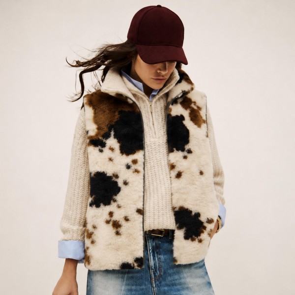 Faux Fur Cow Print Vest with a plush, shaggy pile and a bold western inspired cow pattern. Layer it over sweaters, flannels and button downs for instant warmth and texture on chilly days. A statement layering piece for fall festivals, game days, holiday gatherings and rodeo season. Cow print is a standout trend, and this cozy vest gives shoppers an easy way to wear it.