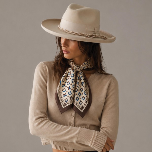 Medallion print bandana scarf in a lightweight woven finish, patterned edge to edge and finished with clean rolled hems. The generous square ties at the neck, knots onto a handbag strap, or layers under a collar for an easy western look. Soft enough to wear from morning to night without feeling bulky. An impulse priced accessory that moves fast off a counter display.
