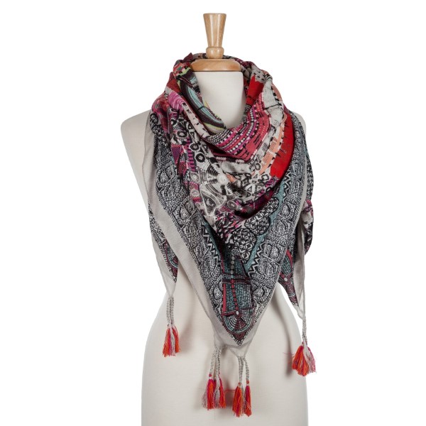 Lightweight, pink and orange abstract printed blanket scarf with tassels. 100% polyester.