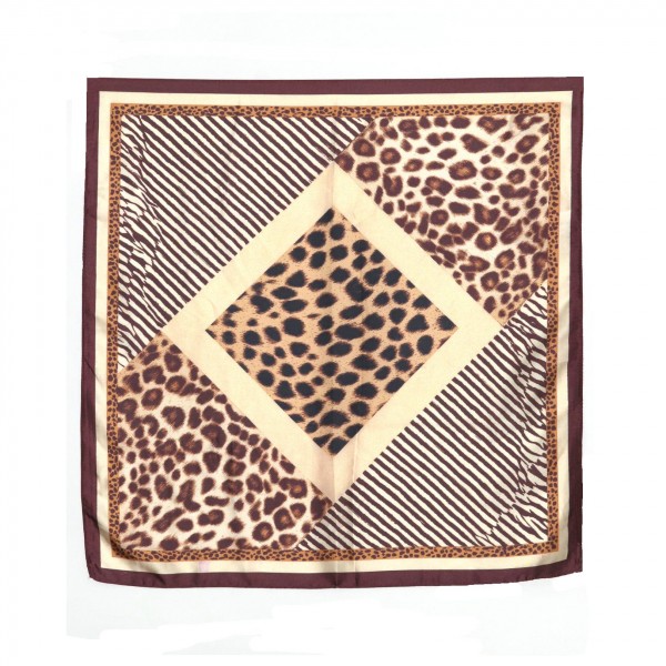 Leopard Print Bandana Scarf, a 27.5 inch square of silky 100% polyester that frames a leopard print center with bold stripe panels and a decorative border. Knot it at the neck, wear it as a headscarf, or tie it around a bag handle for a polished finish. Animal print is a fall staple, and this mixed print square gives customers a fresh way to wear the trend. An easy impulse buy that dresses up sweaters, tees, and jackets in seconds.