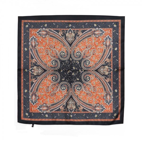Paisley Print Bandana Scarf, a 27.5 inch square of silky 100% polyester printed with an ornate paisley medallion and a detailed border. Tie it at the neck, wear it as a headscarf or bandana, or knot it onto a handbag strap for an instant update. The classic paisley pattern pairs easily with denim, western looks, and cozy fall layers. A versatile accessory at an easy impulse price, this square scarf is a simple addition that sells right off the counter.