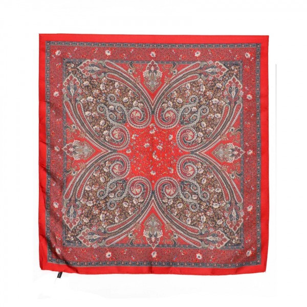Paisley Print Bandana Scarf, a 27.5 inch square of silky 100% polyester printed with an ornate paisley medallion and a detailed border. Tie it at the neck, wear it as a headscarf or bandana, or knot it onto a handbag strap for an instant update. The classic paisley pattern pairs easily with denim, western looks, and cozy fall layers. A versatile accessory at an easy impulse price, this square scarf is a simple addition that sells right off the counter.