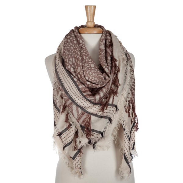 Beige and brown lightweight printed blanket scarf with fringe details. 100% viscose. 