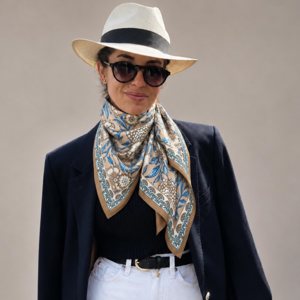 Botanical Print Square Scarf in silky 100% polyester, measuring 27.5 inches square. A detailed print of blooms, vines, and leaves is framed by a patterned border for a classic, collected look. Wear it at the neck with a crisp button down, tie it around a ponytail, or knot it onto a handbag. Offered in several colorways, it is a versatile everyday accessory that customers can style a dozen ways.