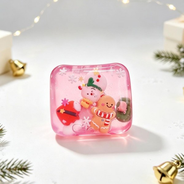 Christmas Jelly Cube Squishy

Christmas Jelly Cube Squishy shaped like a glossy ice cube with festive charms floating inside, including gingerbread men, snowmen, mittens, and snowflake confetti. The clear, rubbery shell is filled with a thick, gooey jelly that gives a slow, dense squeeze, then gradually settles back into a perfect cube. It feels smooth and cool in the hand and looks like a mini holiday snow globe sitting on a desk. Ice cube squishies are one of the hottest textures right now, and this Christmas version is a natural stocking stuffer.

- Holiday charms sealed inside the clear cube