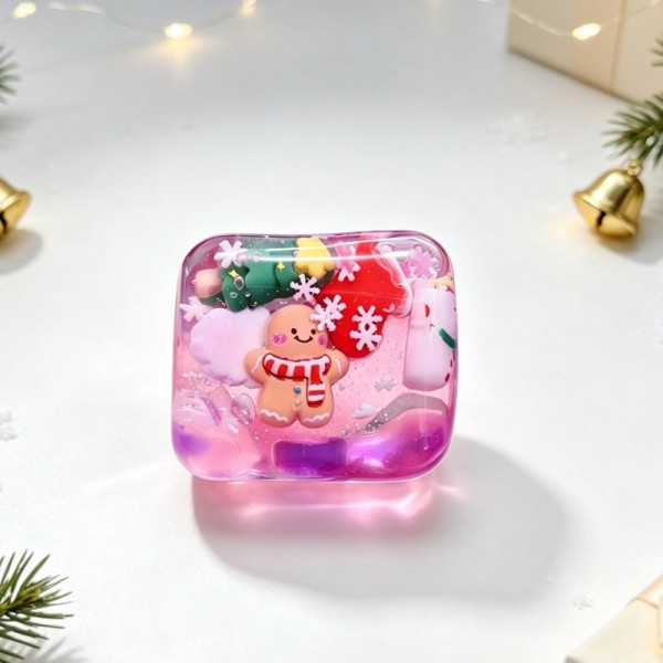 Christmas Jelly Cube Squishy

Christmas Jelly Cube Squishy shaped like a glossy ice cube with festive charms floating inside, including gingerbread men, snowmen, mittens, and snowflake confetti. The clear, rubbery shell is filled with a thick, gooey jelly that gives a slow, dense squeeze, then gradually settles back into a perfect cube. It feels smooth and cool in the hand and looks like a mini holiday snow globe sitting on a desk. Ice cube squishies are one of the hottest textures right now, and this Christmas version is a natural stocking stuffer.

- Holiday charms sealed inside the clear cube