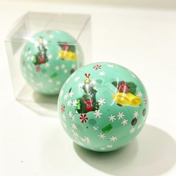 Christmas Charm Squishy Stress Ball

Christmas Charm Squishy Stress Ball with a clear, stretchy shell packed with holiday surprises inside. Each style has its own festive fill, from sparkly glitter beads and candy sprinkles to a snow globe style flurry or a smooth, dough like center, all mixed with peppermints, snowflakes, and charms like Santa, gingerbread men, a snowman, and reindeer. Squeeze it to feel the filling shift and press against your palm, then watch it pop back round. A colorful stocking stuffer that looks great piled in a bowl by the register.

- Every style has a different holiday fill