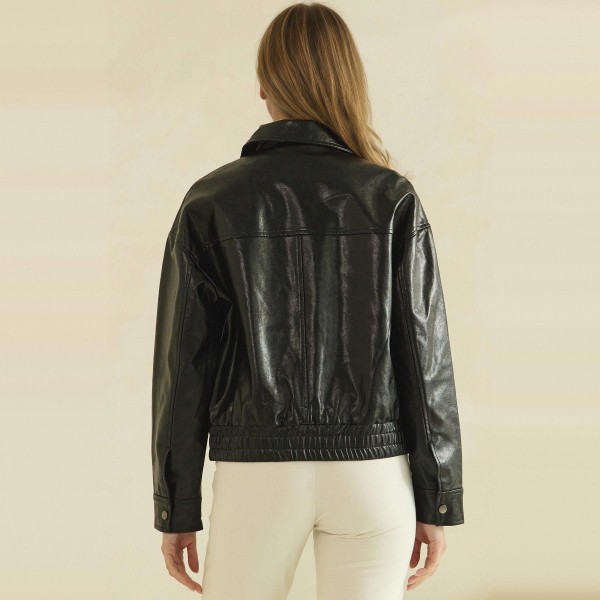Faux Leather Bomber Jacket with a classic point collar, full zip front, flap chest pockets, and a smocked elastic waistband for a flattering cinched fit. The soft vegan leather has a rich, buttery finish that layers easily over turtlenecks, tees, and sweaters. A versatile outerwear piece for crisp fall days, game nights, and weekend errands. Boutique shoppers love an affordable leather look, and this bomber silhouette sells season after season.