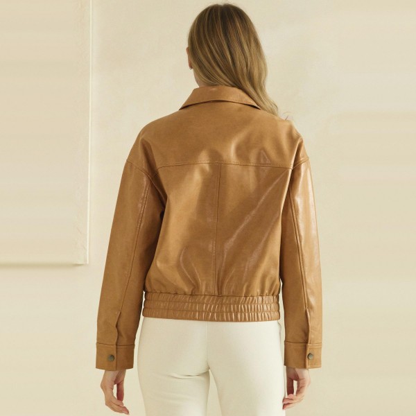 Faux Leather Bomber Jacket with a classic point collar, full zip front, flap chest pockets, and a smocked elastic waistband for a flattering cinched fit. The soft vegan leather has a rich, buttery finish that layers easily over turtlenecks, tees, and sweaters. A versatile outerwear piece for crisp fall days, game nights, and weekend errands. Boutique shoppers love an affordable leather look, and this bomber silhouette sells season after season.