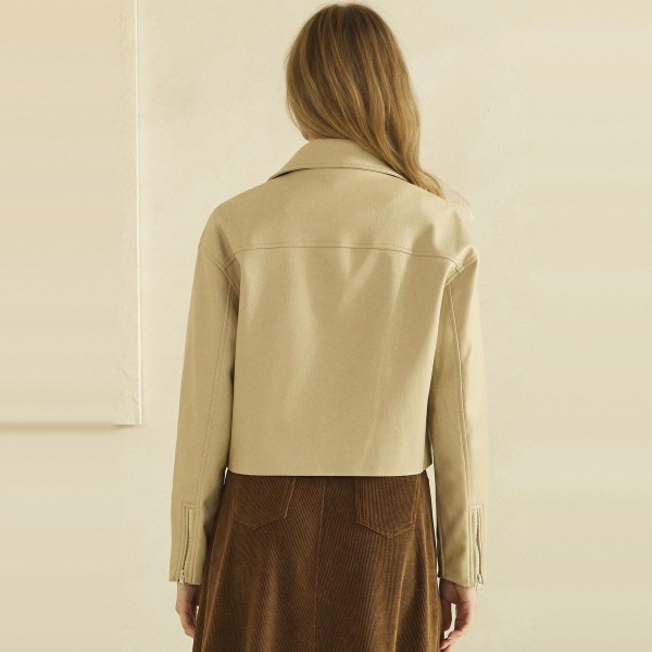 Cropped Faux Leather Jacket with a full zip front, wide point collar, and zippered chest pocket. The soft vegan leather has a smooth, supple finish and a boxy cropped fit that pairs perfectly with high waisted jeans, dresses, and wide leg pants. An easy layering piece for cool fall evenings, concerts, and weekend outings. Faux leather jackets are a top seasonal request, and this cropped cut gives customers a modern take that moves fast.