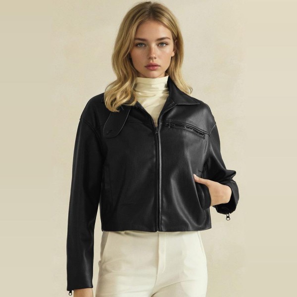 Cropped Faux Leather Jacket with a full zip front, wide point collar, and zippered chest pocket. The soft vegan leather has a smooth, supple finish and a boxy cropped fit that pairs perfectly with high waisted jeans, dresses, and wide leg pants. An easy layering piece for cool fall evenings, concerts, and weekend outings. Faux leather jackets are a top seasonal request, and this cropped cut gives customers a modern take that moves fast.