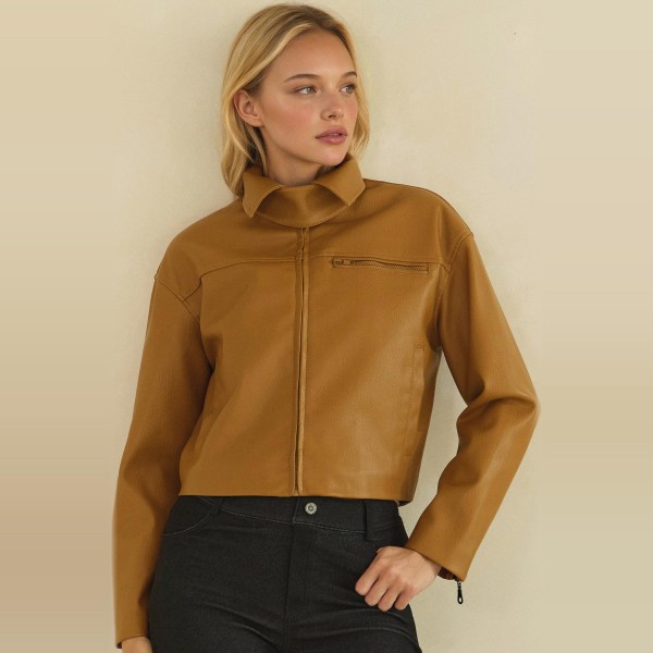 Cropped Faux Leather Jacket with a full zip front, wide point collar, and zippered chest pocket. The soft vegan leather has a smooth, supple finish and a boxy cropped fit that pairs perfectly with high waisted jeans, dresses, and wide leg pants. An easy layering piece for cool fall evenings, concerts, and weekend outings. Faux leather jackets are a top seasonal request, and this cropped cut gives customers a modern take that moves fast.